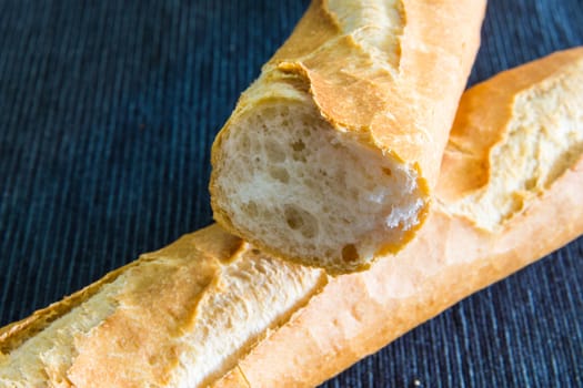 Closeup of two french baguette over a cloth