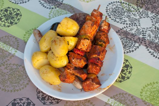 Plate with baked meat and potatoes