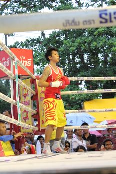 SURAT THANI, THAILAND - DECEMBER 14 : Usanakorn Kokietgym WBC Super Flyweight Champion wait to fight boxig with Leeyunting  on December 14, 2012 in Surat Thani, Thailand.