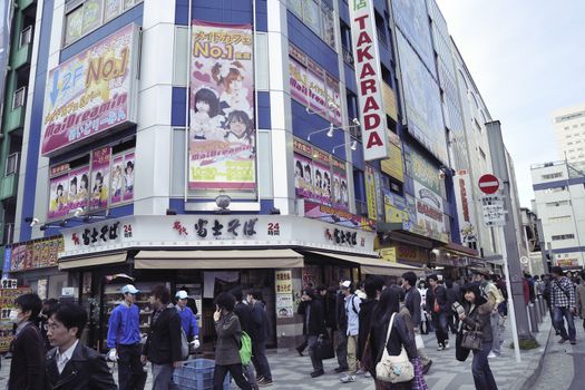 TOKYO, JAPAN -APRIL 17, 2011 : early evening with crowds of people on the streets of Akihabara. Akihabara is worldwide famous main electronic market place in central Tokyo