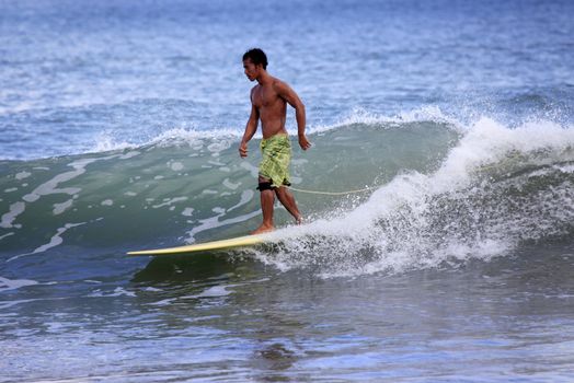 Man-surfer in ocean. Bali. Indonesia