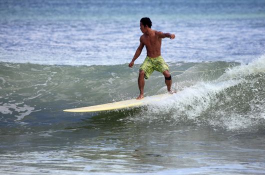 Man-surfer in ocean. Bali. Indonesia