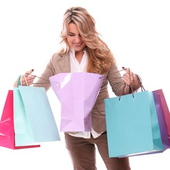 Beautiful middle aged woman smiling and checking her shopping bags