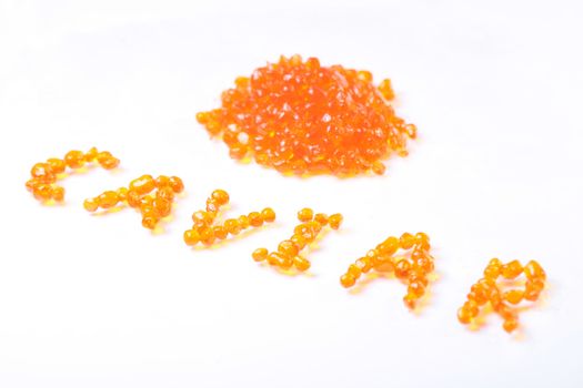 Writed from tasty caviars word caviar over a white background