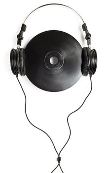 Headphones with black CD on white background