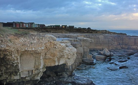 Beach Huts on a cliff top at  on Portland in Dorset