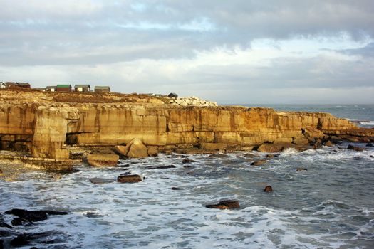 Beach Huts on a cliff top at  on Portland in Dorset