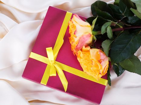 gift with yellow roses on silk