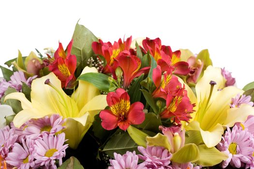 Yellow lilies, orchids and chrysanthemums in a bouquet isolated on white background