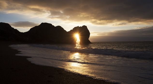 Sunset on Durdle Door Beach in Dorset England