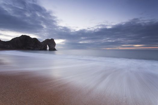 Sunset on Durdle Door Beach in Dorset England