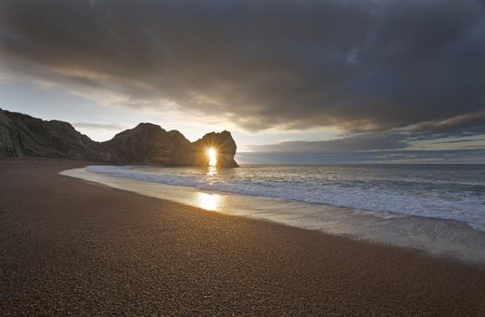 Sunset on Durdle Door Beach in Dorset England