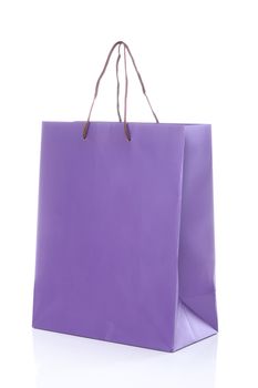 Close up of one purple shopping bag isolated on a white