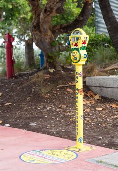 MIAMI BEACH, FLORIDA - 3 DECEMBER. Painted parking meter collects charitable donations in Miami Beach on December 3, 2012. The Romero-Britto designed meters have been installed by the Homeless Trust