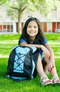 Eight year old biracial girl excited about first day of school