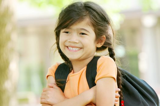Adorable five year old girl ready for first day of school;