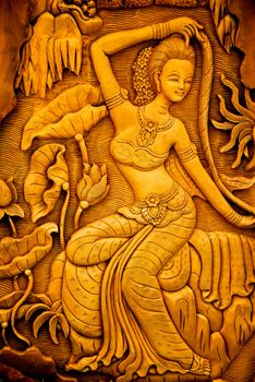 Carved woman on the wall