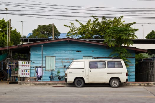 old car in front of house