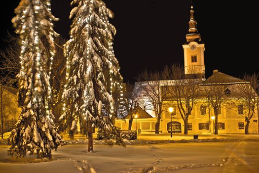 Christmas time idylic winter cityscape evening in snow, Town of Krizevci, Croatia