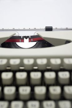a close up of typewriter, focus on paper where message will be typed.