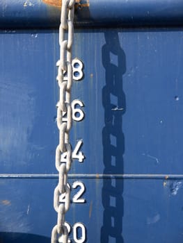 white chain on the anchored ship