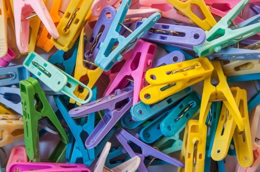 A colorful cloth pegs for background and texture.