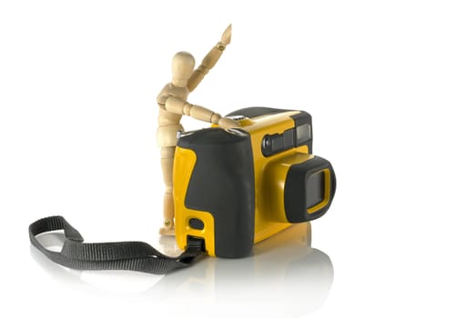 wooden puppet with yellow camera