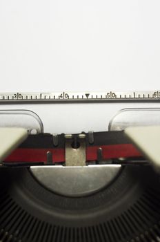 a close up of typewriter, focus on paper where message will be typed.