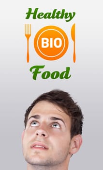 Young persons head looking with gesture at healthy food sign