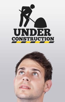 Young persons head looking at construction signs