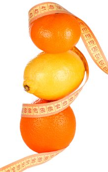 Weight loss and healthy dieting concept. Orange, lemon and mandarin with measure tape. Isolated over white.
