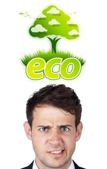 Young persons head looking at green eco sign