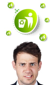 Young persons head looking at green eco sign