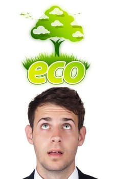 Young persons head looking at green eco sign