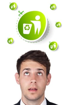 Young persons head looking at green eco sign