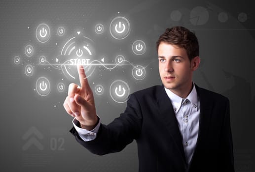 Businessman pressing simple start buttons on a virtual background