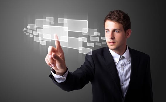 Businessman pressing high tech type of modern buttons on a virtual background