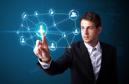 Businessman pressing modern social buttons on a virtual background