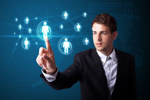 Businessman pressing modern social buttons on a virtual background
