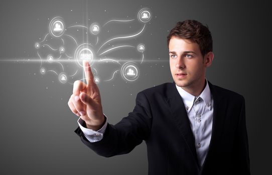 Businessman pressing modern social buttons on a virtual background
