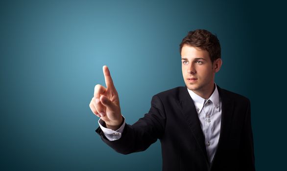 Businessman pressing an imaginary button on bokeh 