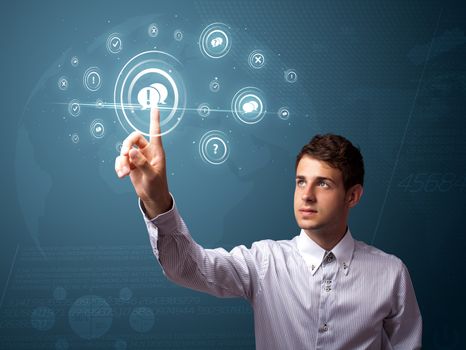 Businessman pressing modern social buttons on a virtual background