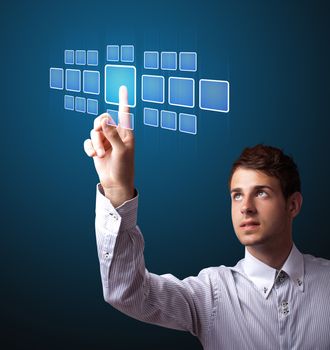 Businessman pressing high tech type of modern buttons on a virtual background