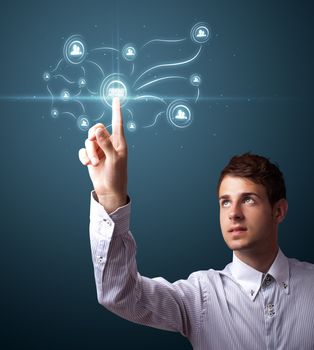 Businessman pressing modern social buttons on a virtual background