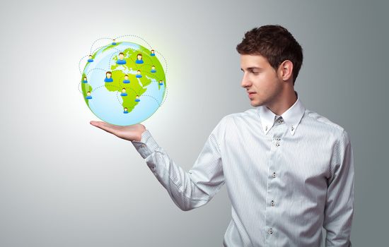 Young businessman holding virtual eco sign