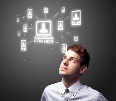 Businessman pressing modern social buttons on a virtual background