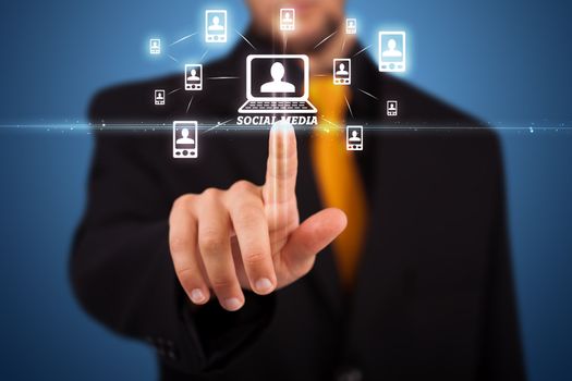 Businessman pressing modern social buttons on a virtual background