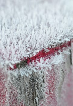 Many Frost on a Picket with a Red Line and a blurred effect