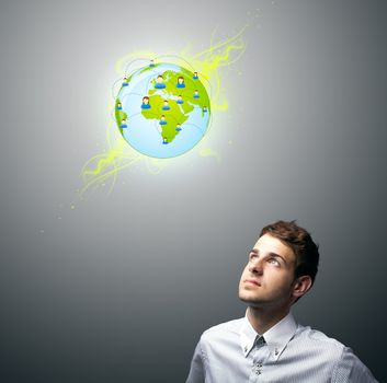 Young businessman holding virtual eco sign