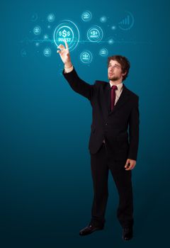 Businessman pressing business type of modern buttons with virtual background